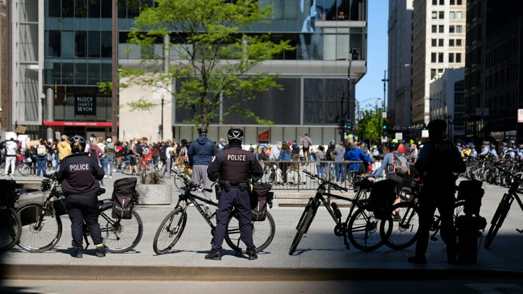 police prepare for election day civil unrest as a political protest moves through a downtown area during a moment of civil unres