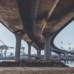 Securing Infrastructure - A view from under a bridge looking out towards the shipping yard.