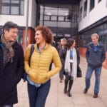 A group of people walking outside to represent how Community Policing Strategies can bring communities closer