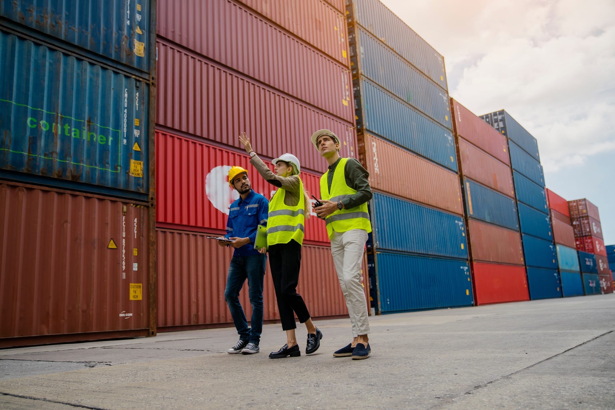 Team members working in logistics discuss supply chain security